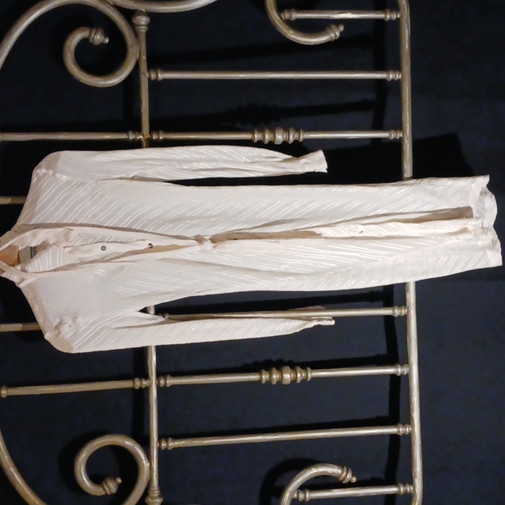 Anna Huling, fitted and belted white silk dress.